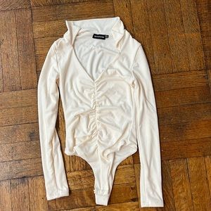 Long sleeve body suit- Never worn! Size 2.